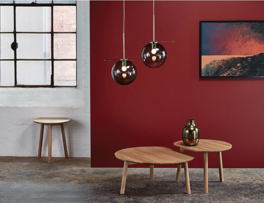 A modern living space with 2 nested coffee tables.