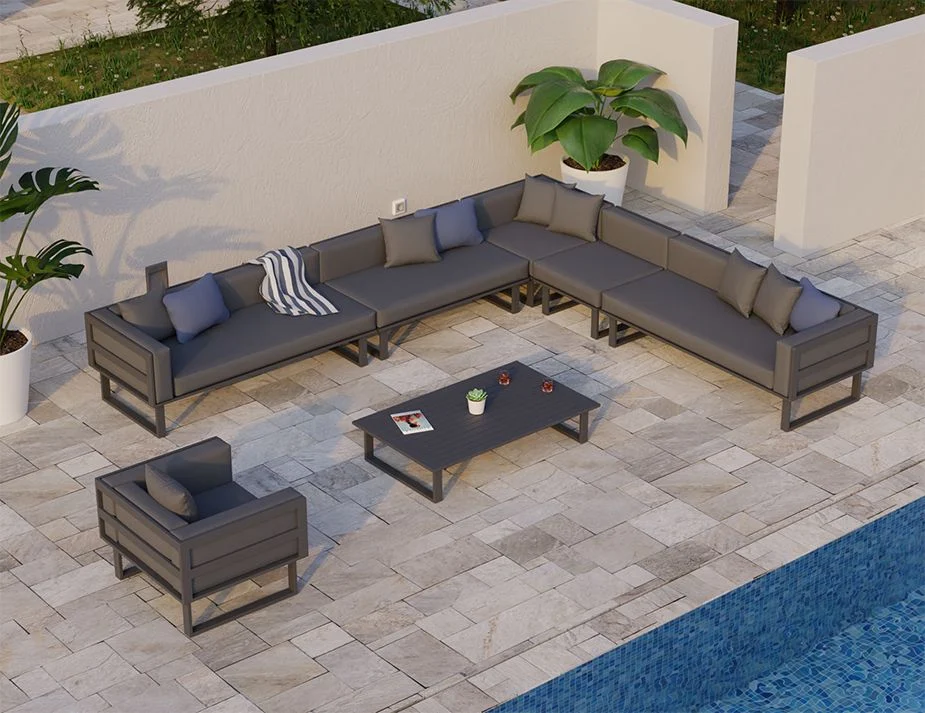 An outdoor seating area with a modern design is shown. The seating arrangement is modular, allowing flexibility in configuration.
