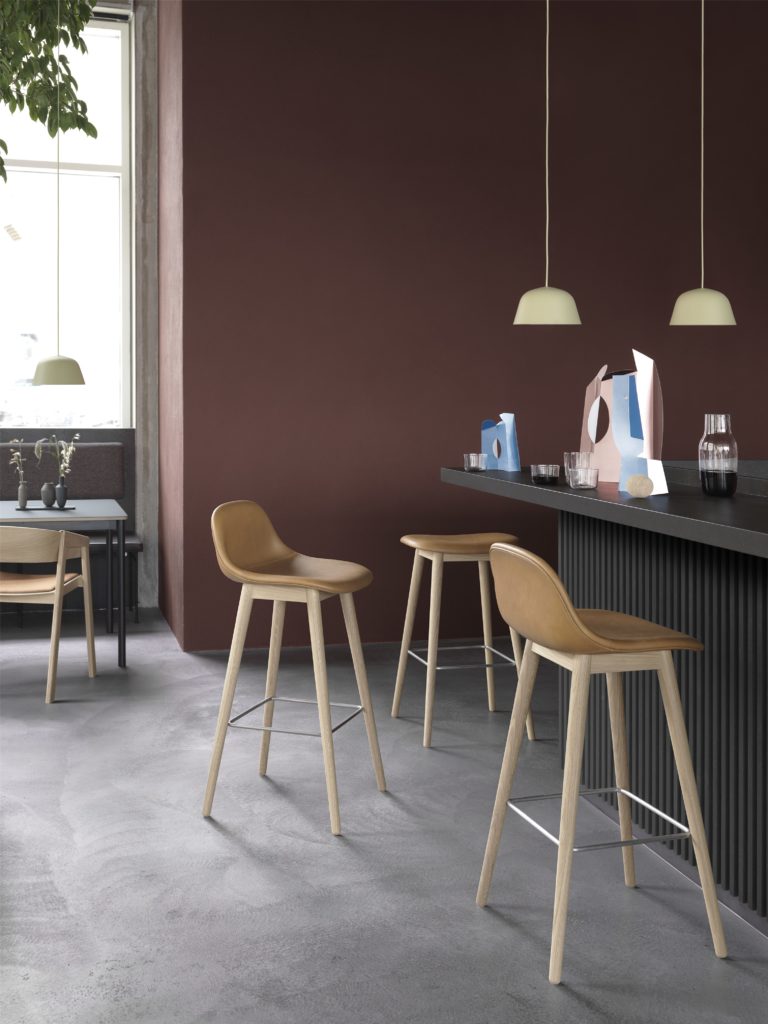 upholstered padded bar stools in tan leather in a house