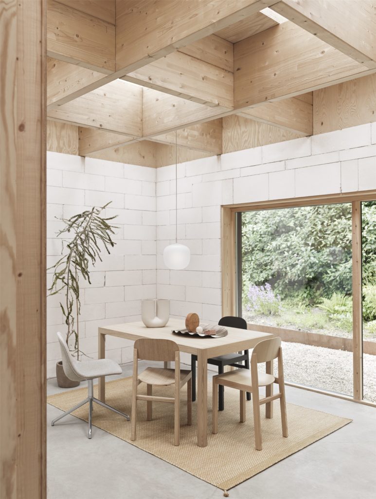 modern glass pendant in house surrounded by wood roof and walls