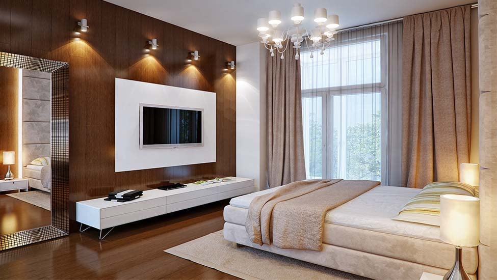 A modern bedroom interior with warm wall sconces.
