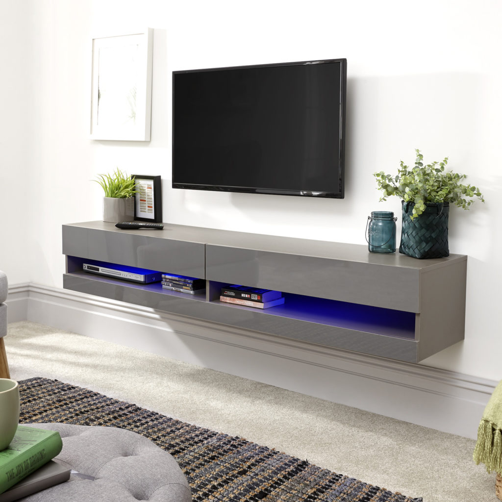 A living room with grey mounted TV cabinet.