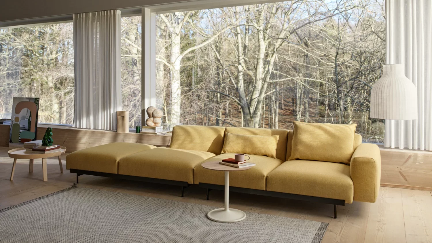 A spacious living room with a mustard-coloured modular couch.