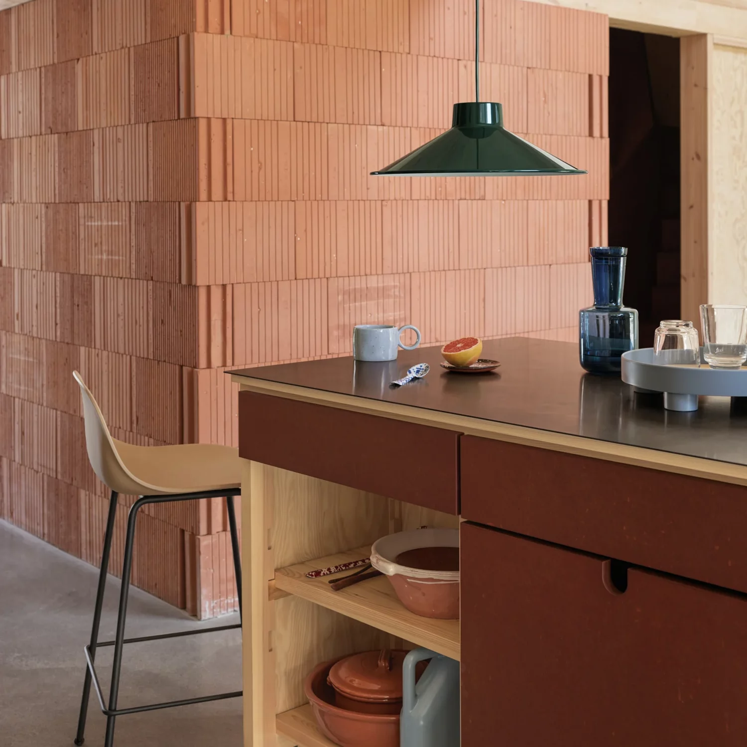 Kitchen with a brown countertop and kitchen stool.