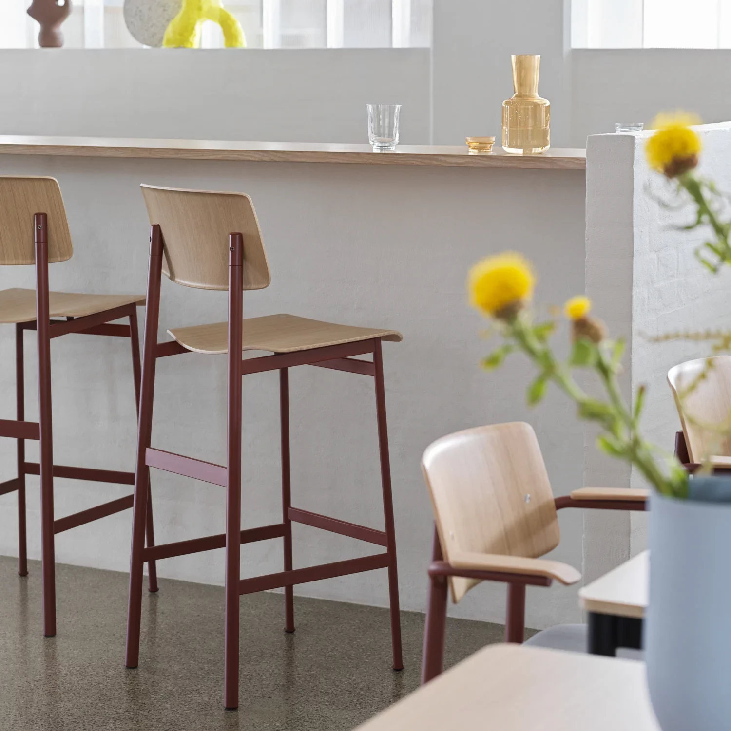 Dining area with wooden kitchen stools.