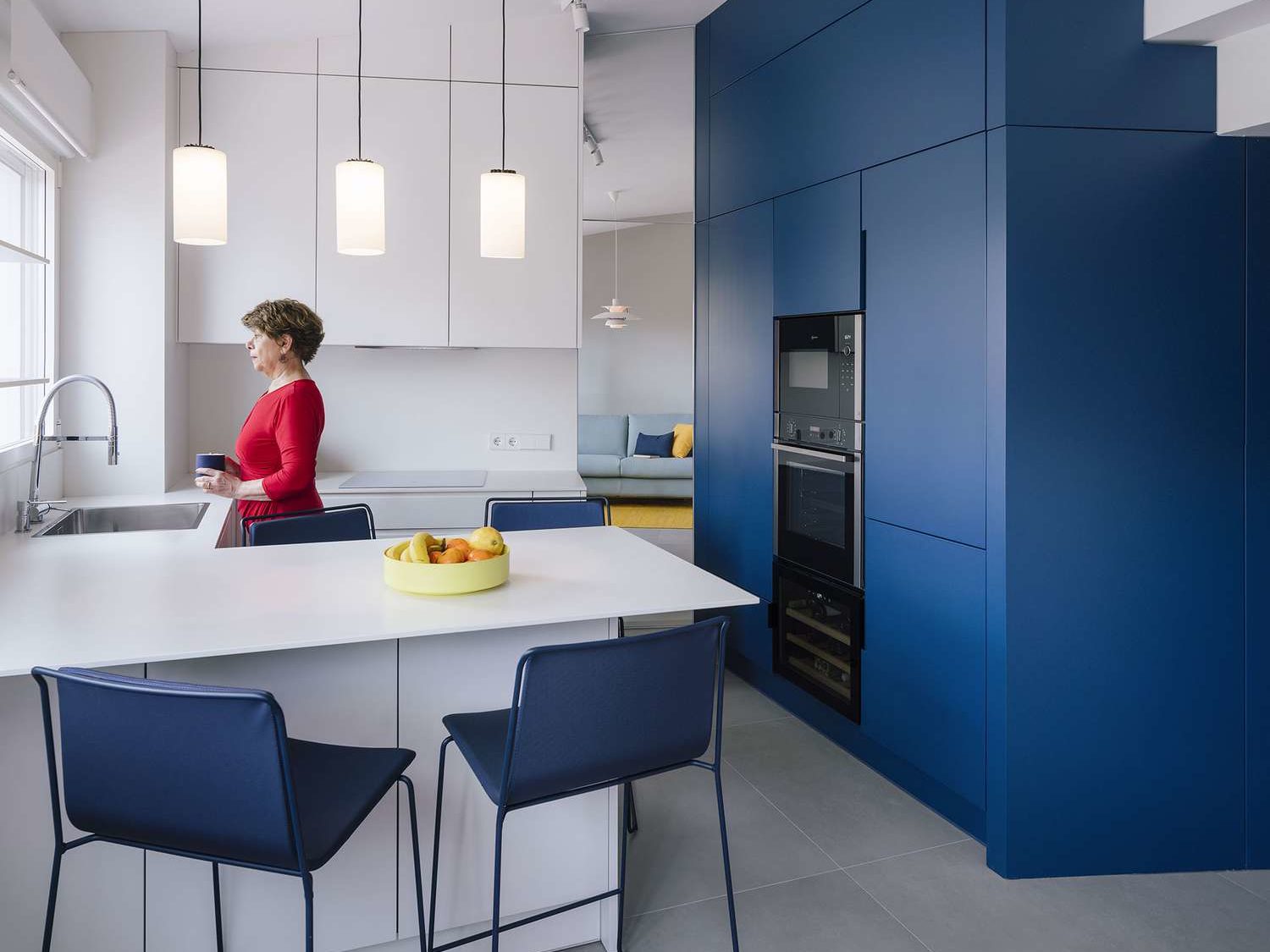 Modern kitchen with sleek blue cabinets.