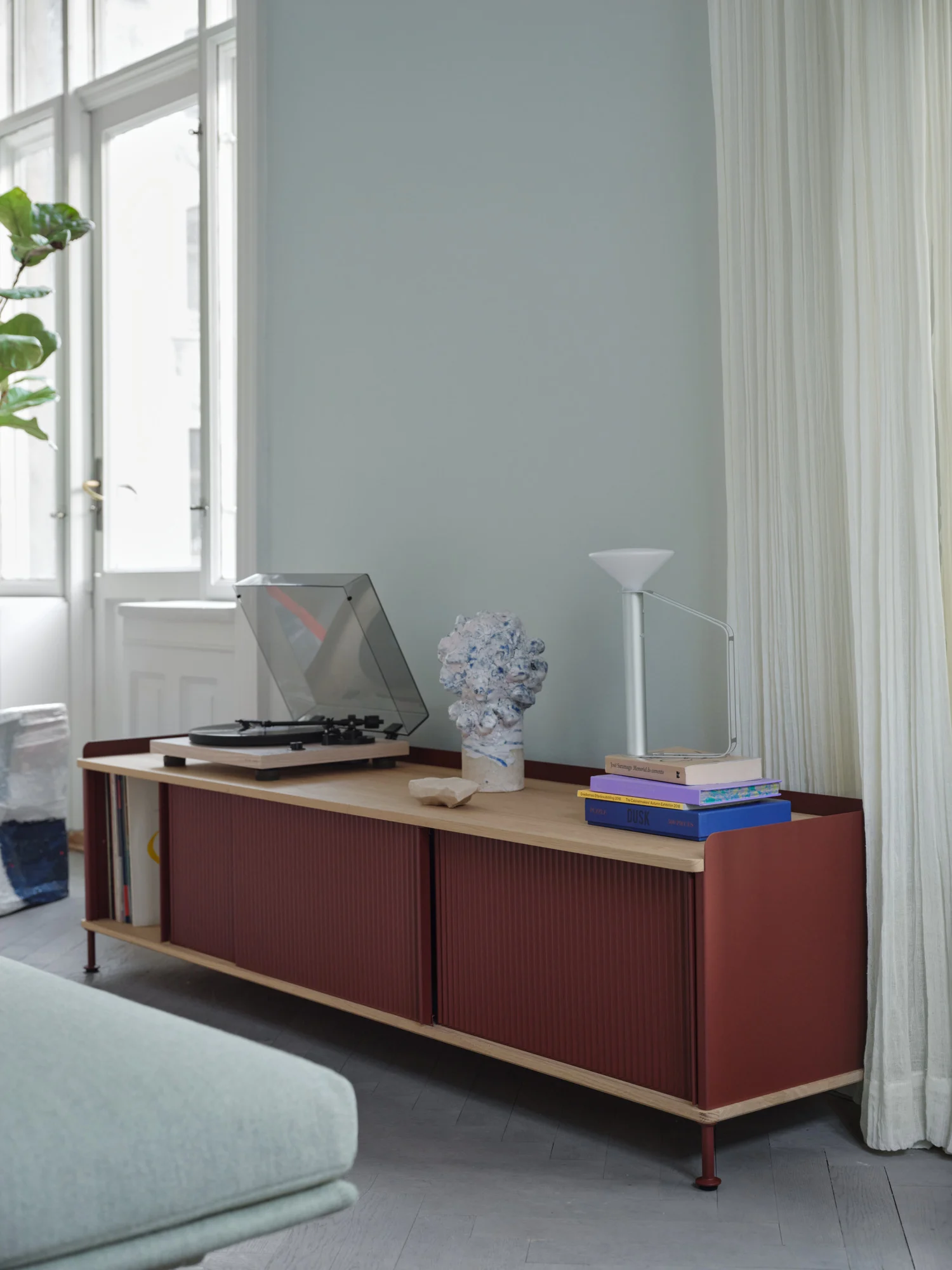 Oak wooden sideboard in red colour.