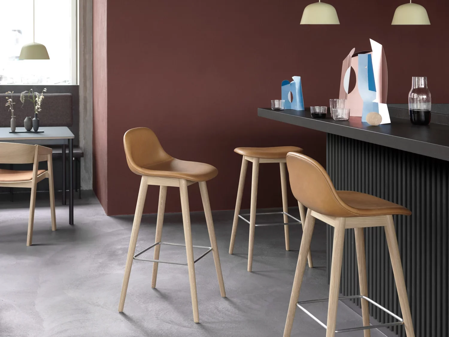 Dining space, with beige bar stools.