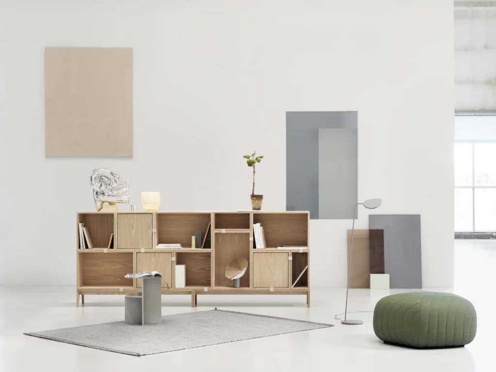 Living space featuring a wooden modular shelving unit.