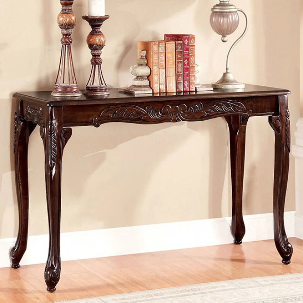 An ornate wooden console table with intricate carvings.