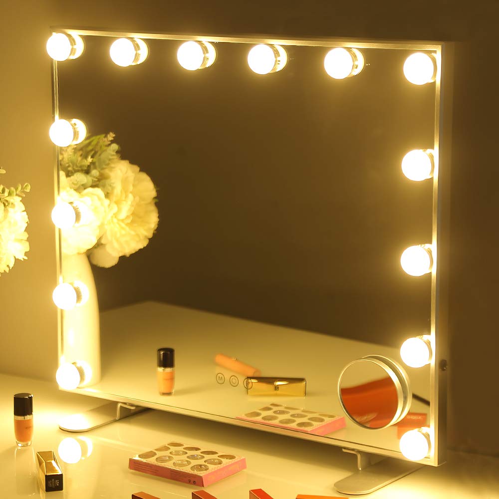 A close-up view of a vanity mirror with illuminated light bulbs.