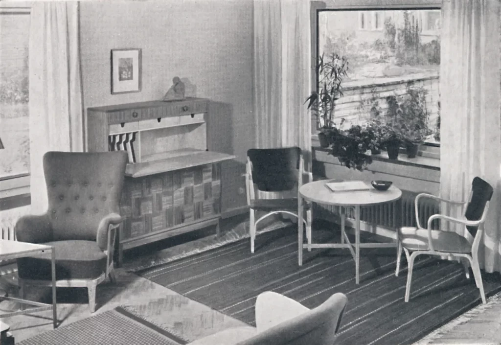 A vintage photograph of a mid-century living room.