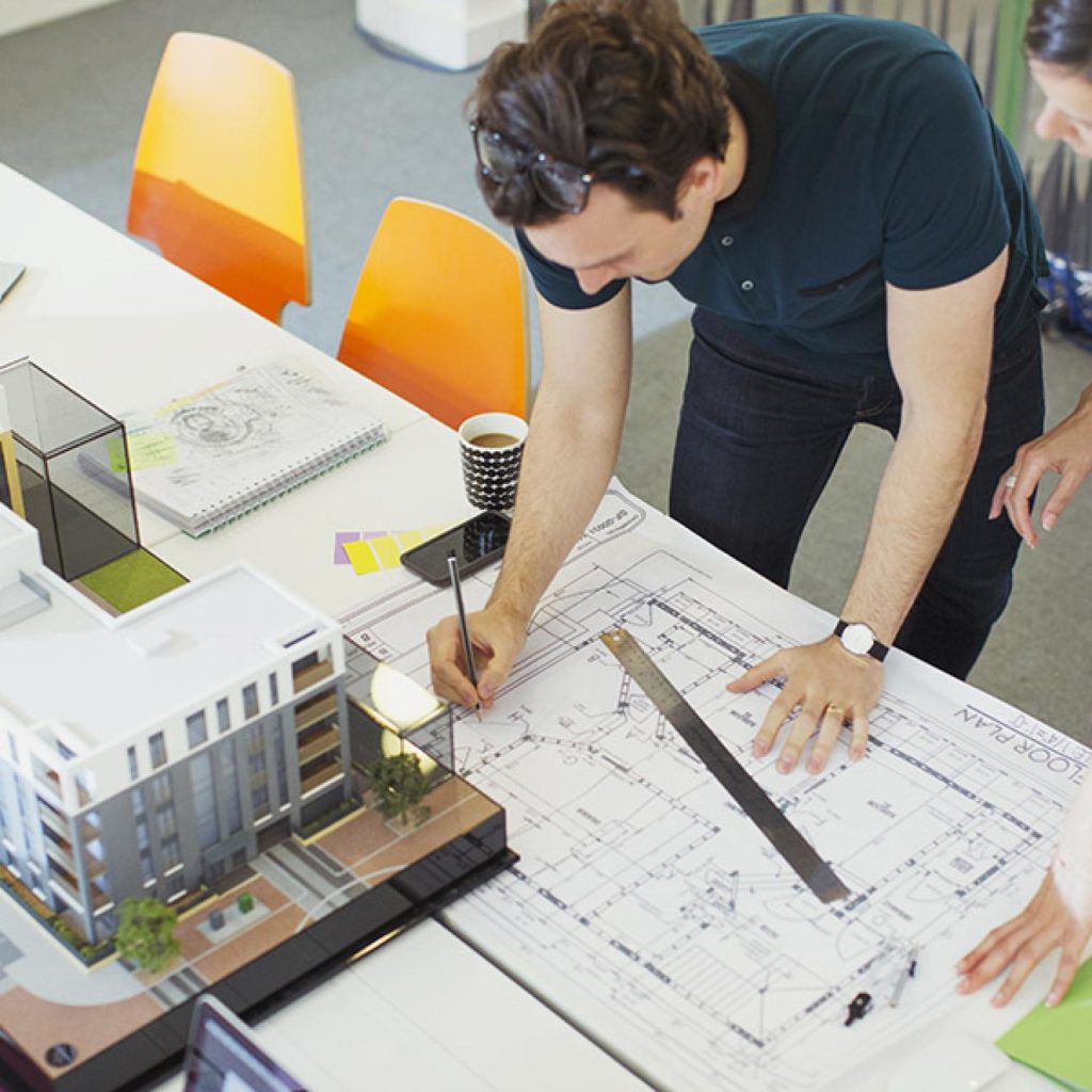 An architect sketching a building plan.