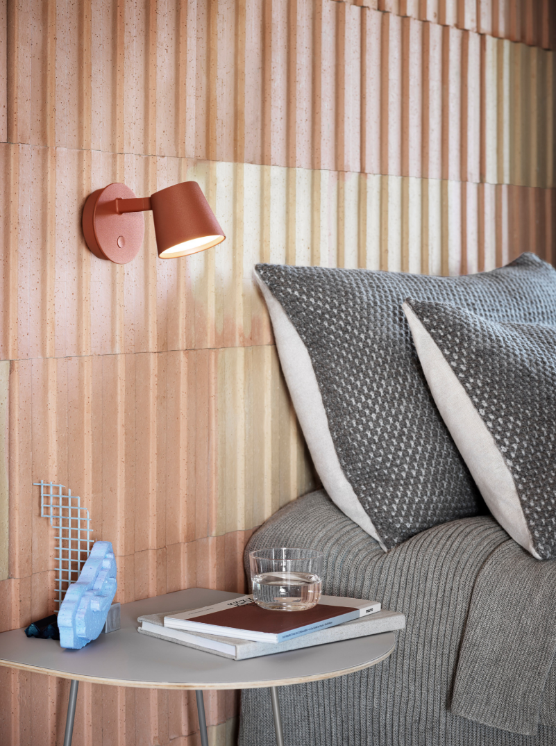 Modern bedroom with pink wall scones