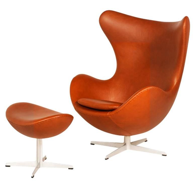 An orange egg chair by Arne Jacobsen.
