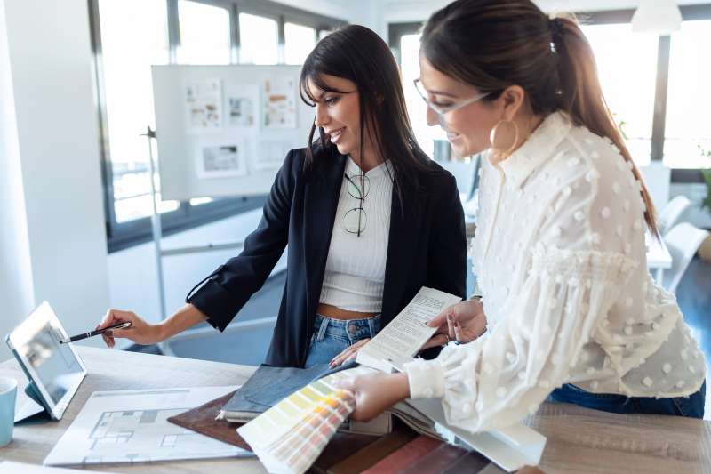 explainer hire interior designer A customer and interior designer working together.