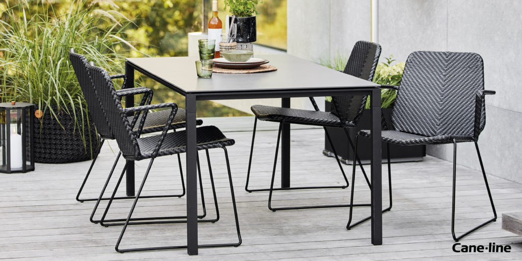 Modern black and grey Cane-line chairs and table.