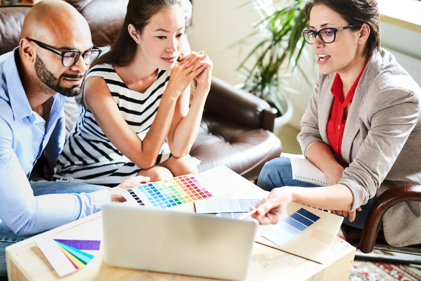 Group of professionals discussing colour palettes.