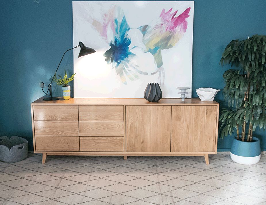 Wooden buffet with three drawers and two cabinets.