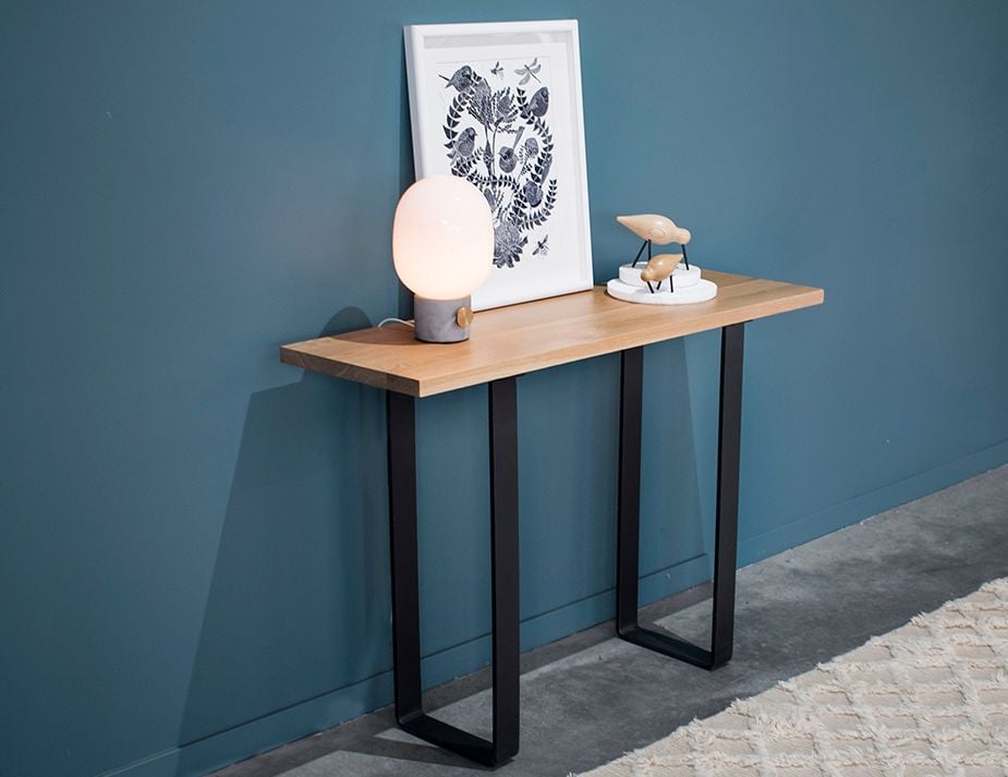 odense cm console A minimalist console table against a blue wall.