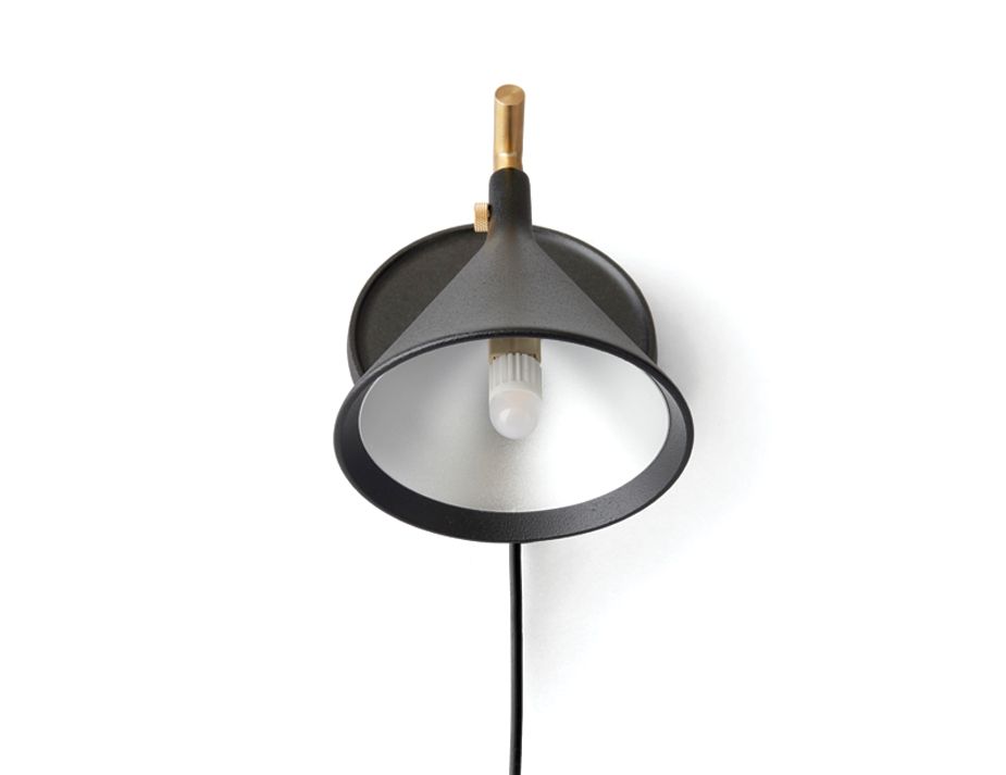 A wall-mounted black lamp with a circular shade.