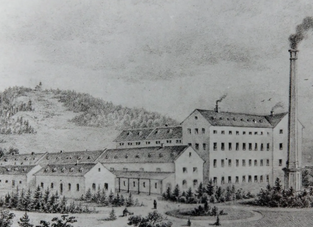 A historical drawing of a large industrial building.

