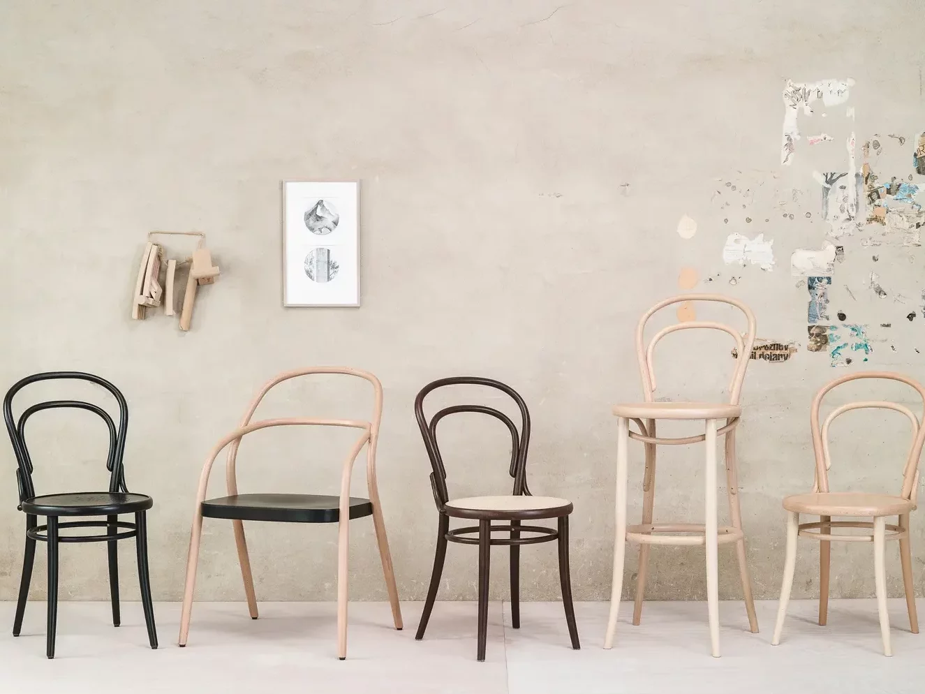 Assorted Thonet bentwood chairs in a row.