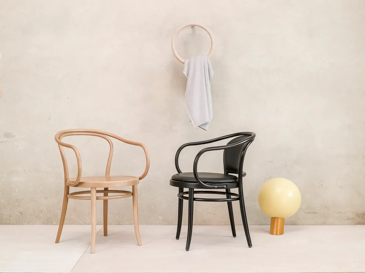 Thonet natural and black bentwood armchairs.