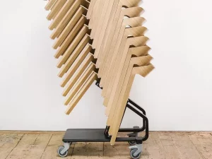 Merano dining chairs stacked in a trolley.