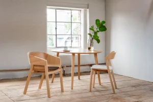 Interior setting featuring a wooden table and chairs.