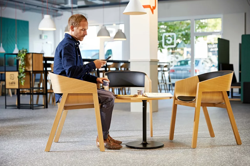 img A man sitting alone in Merano armchair.