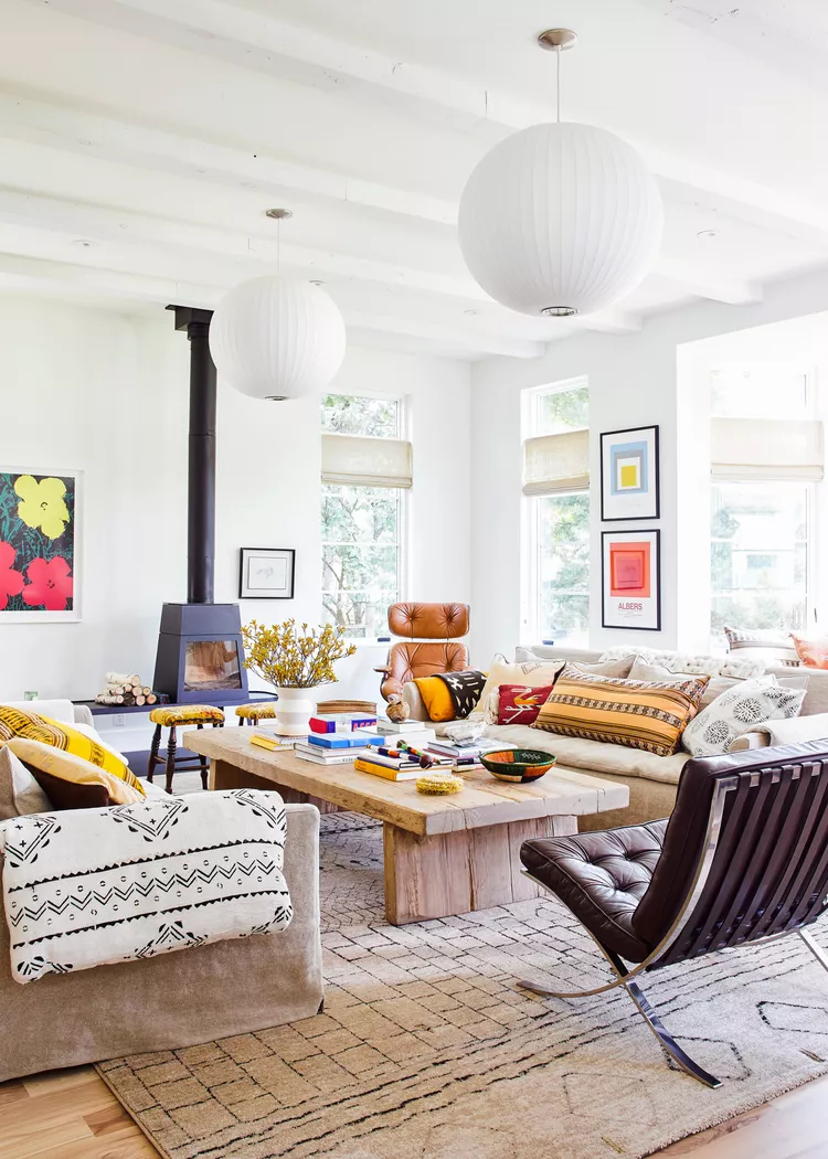 A bright, eclectic living room with mixed textures and colourful accents.