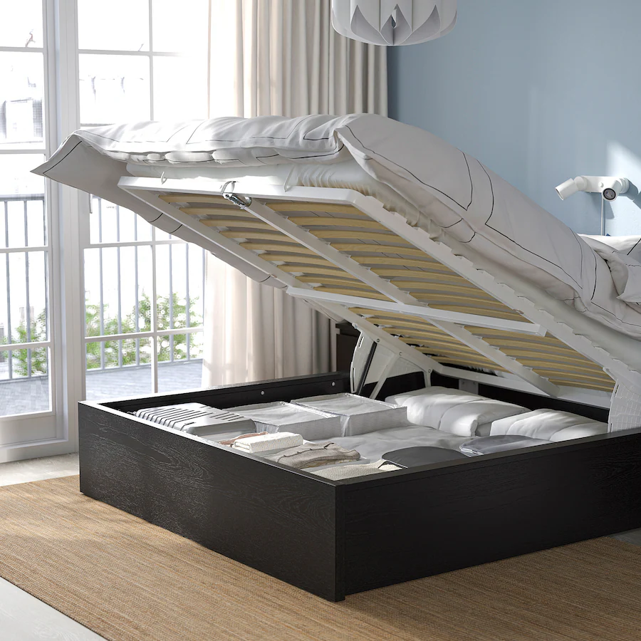 Lifted bed revealing hidden storage underneath.