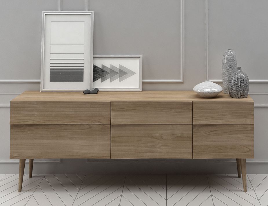 A wooden sideboard with two framed geometric art pieces on top, accompanied by decorative vases, set against a paneled gray wall.



