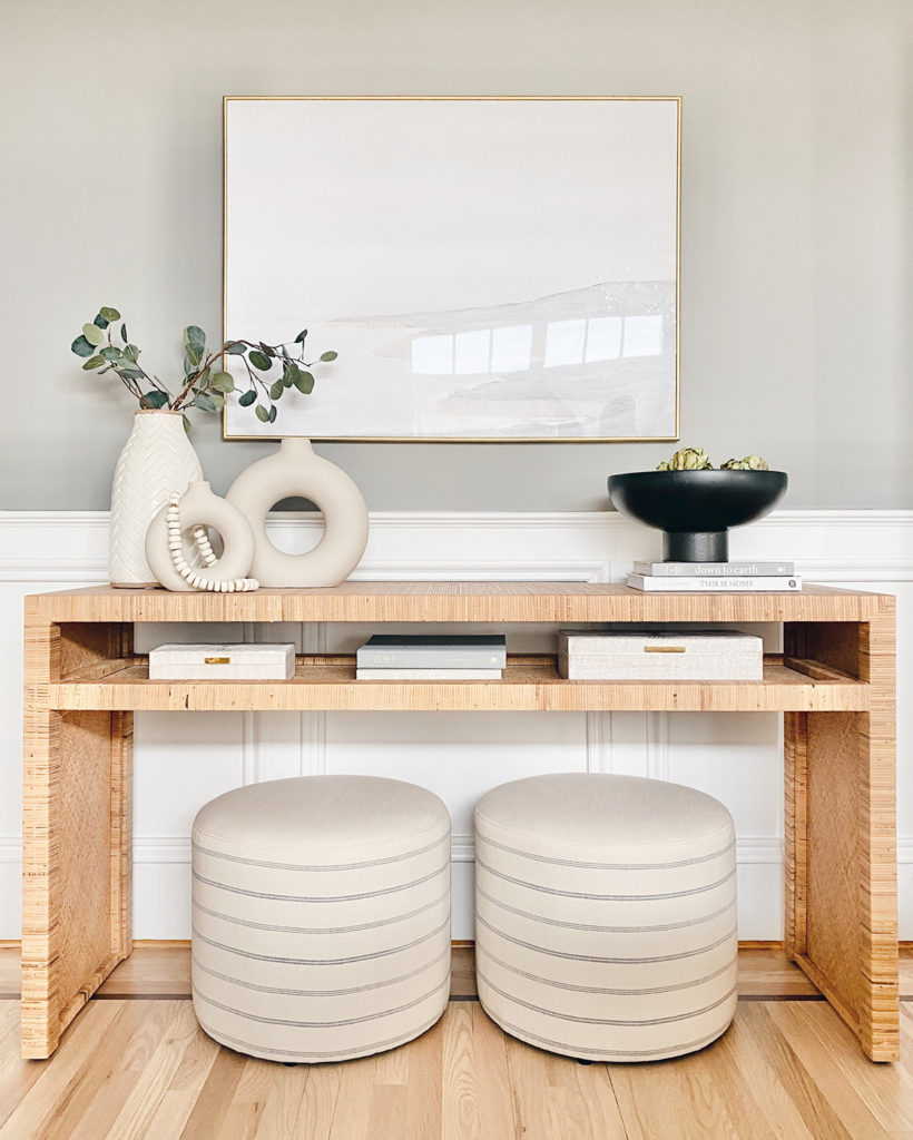 Wooden hallway table against a soft grey wall. 