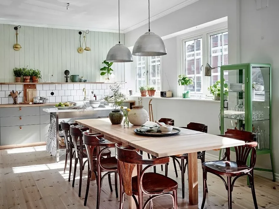 Rustic dining space with Scandinavian wooden chairs.