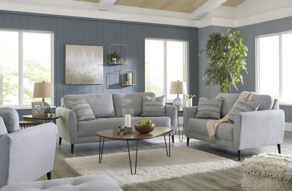 A serene living space featuring plush grey sofas.