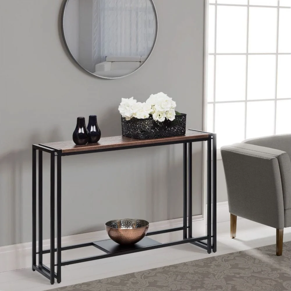 A console table with wooden top and black metal legs.