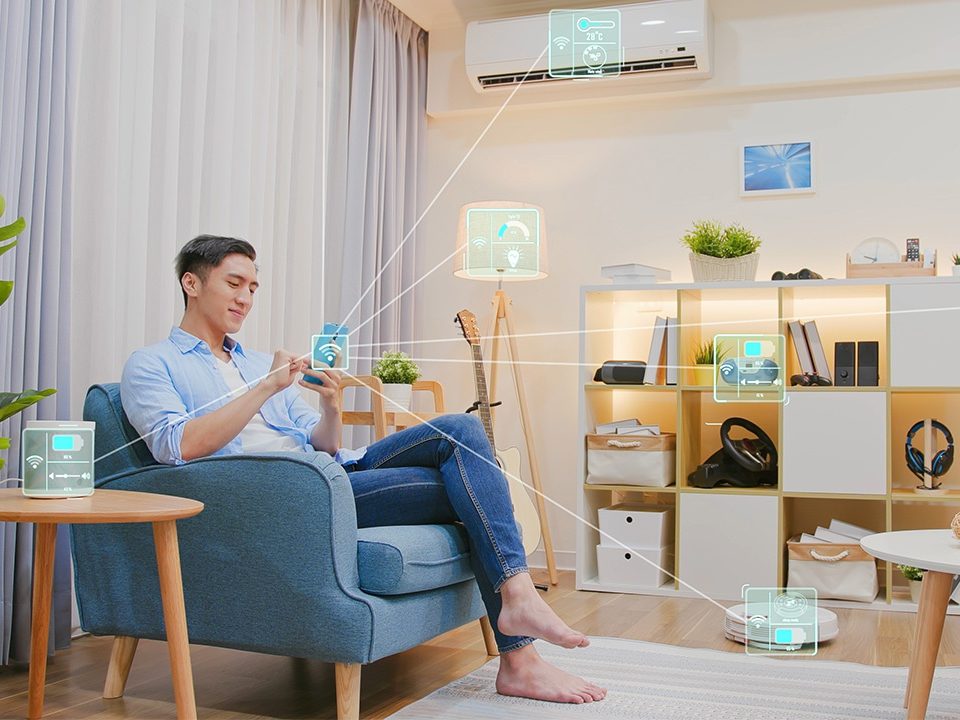 Man in a living room interacting with smart home.
