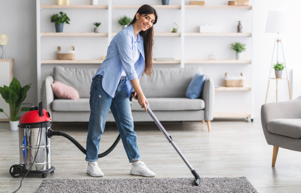 Girl vacuuming mat