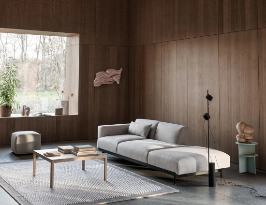 grey 3 seat sofa in wood panelled room